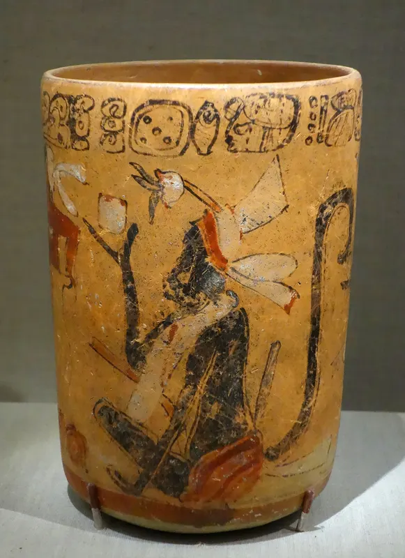A Maya ceramic vase painted with monkeys and a cacao tree